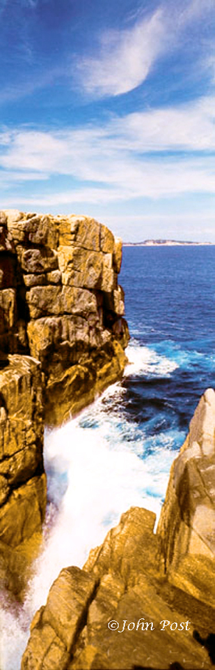 View into rock chasm and Ocean